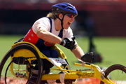 Jean Driscoll of USA celebrates winning gold in the womens Marathon in class 54 during the Sydney 2000 Paralympic Games.  Nick Wilson/Allsport