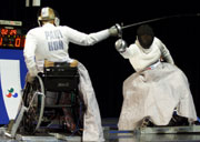 Jadwiga Polasik of Poland on her way to winning Gold in the women's class A Fencing final at the 2000 Paralympic Games.  Nick Wilson/Allsport
